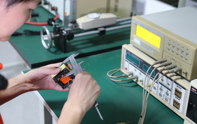 Battery charger factory incoming inspection of PCBs, components, housings, cables and labels before production.
