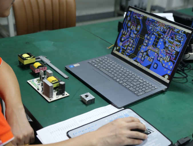 Custom battery charger PCB design coordinating circuit layout, component placement, interfaces and housing structure.