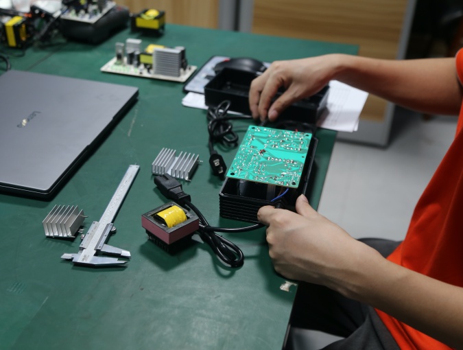 ODM battery charger prototype preparation for custom electrical parameters, connectors, cables, housing and labels.