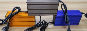 Different Linjia charger housings illustrating why nominal 48V alone does not define battery-chemistry compatibility.