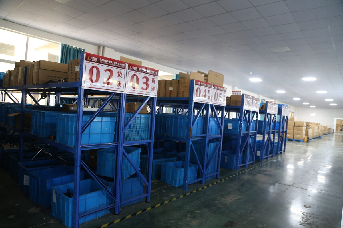 Separated work-in-process racks supporting model and material control for different 48V charger configurations.