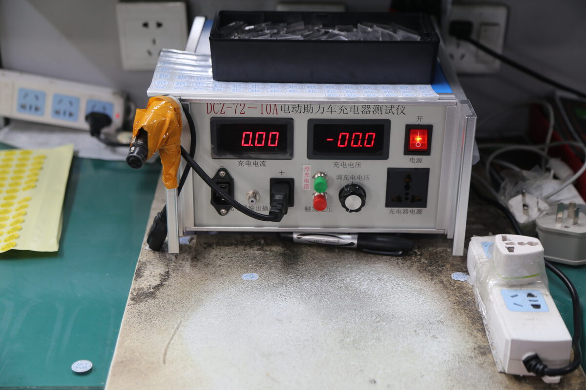 Battery charger output voltage and current test station used to verify an approved 48V charging specification.