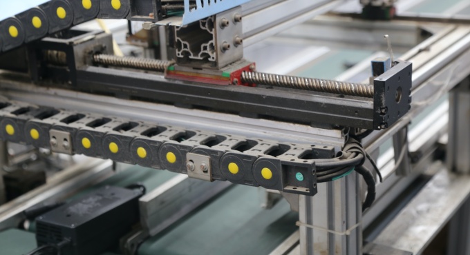 Automated production equipment used on the battery charger assembly line
