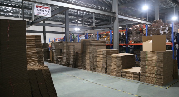 Carton storage area for battery charger packaging materials
