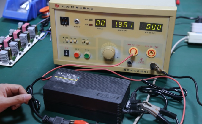 Battery charger dielectric withstand testing for electrical safety quality control
