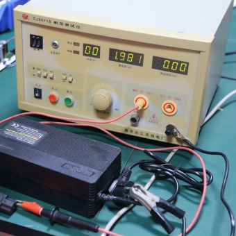 Dielectric withstand testing verifies battery charger insulation strength before final quality inspection and order release.