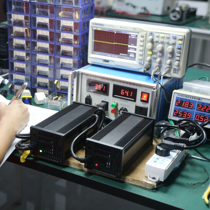 Battery charger factory electrical testing checks output voltage, charging current and operating status before batch release.