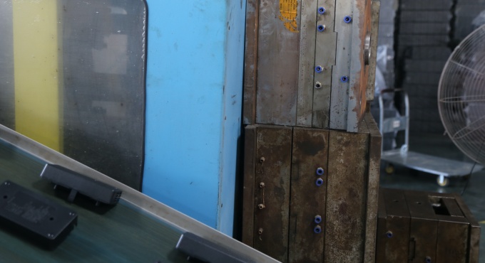 Injection mold tooling used to produce battery charger plastic housings
