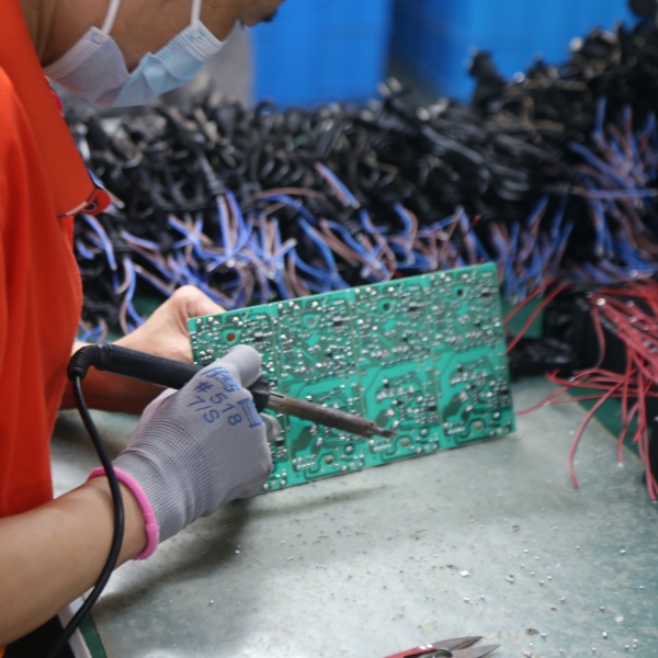 Battery charger PCB production quality control checks soldering, components, wiring and connectors before final assembly.
