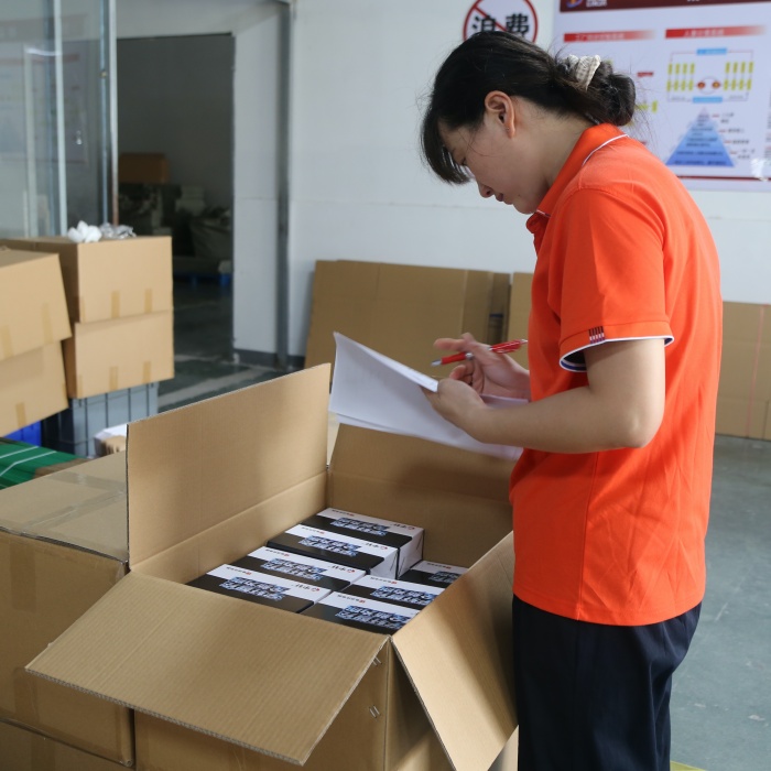 Battery charger supplier checks model labels, packaging and order quantities before bulk batches are prepared for sea shipment. 