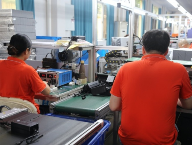 Battery charger testing and packing process with electrical checks, insulation testing, burn-in verification, and batch delivery preparation.