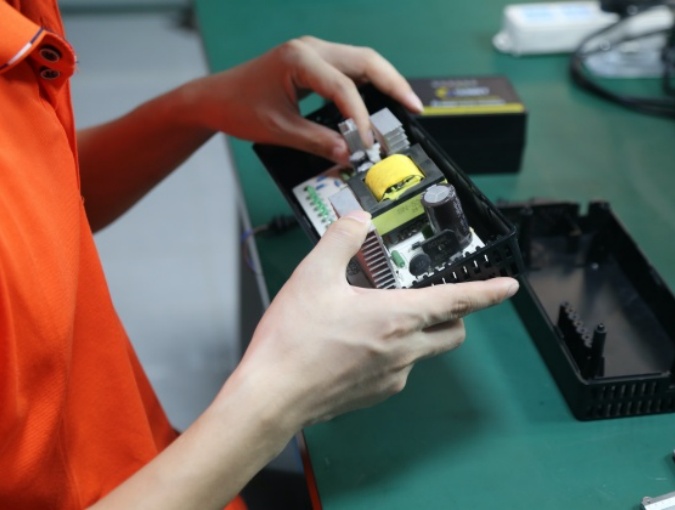 Custom charger housing sample validation before mass production, checking structure fit and project-specific adjustments for OEM orders.