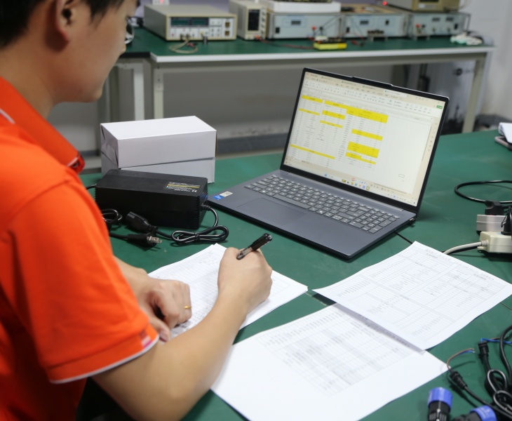 Custom battery charger manufacturer reviewing battery specs, BMS, connectors and market requirements for OEM ODM projects