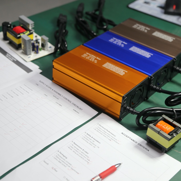 OEM battery charger assembly control covering components, wiring, connectors, inspection duties, and acceptance criteria. 