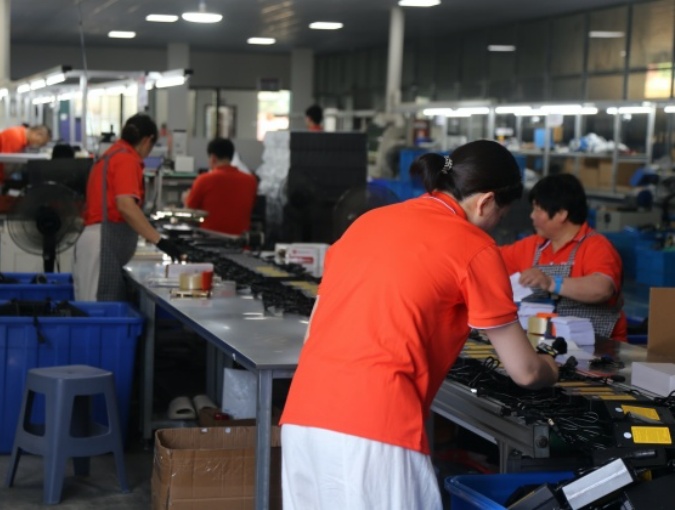 OEM battery charger assembly integrating PCB, cables, connectors, labels, and customized housing configurations for production orders.