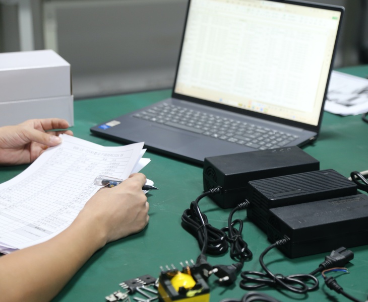 OEM battery charger manufacturer reviewing voltage, BMS, connector and compliance requirements for custom market solutions